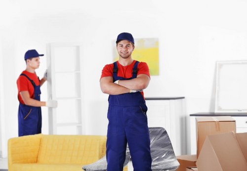Professional removals team handling furniture for a Norwoodgreen move