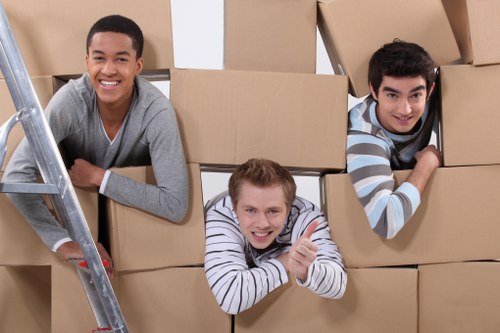 Professional movers handling furniture during a small removals job