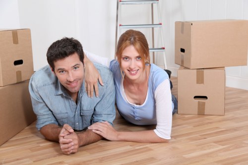 Moving team handling furniture in a Norwoodgreen flat