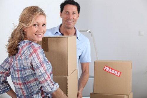 Packed office boxes and labelled equipment ready for transport