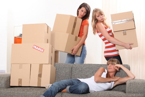Organised temporary storage space with stacked boxes and furniture